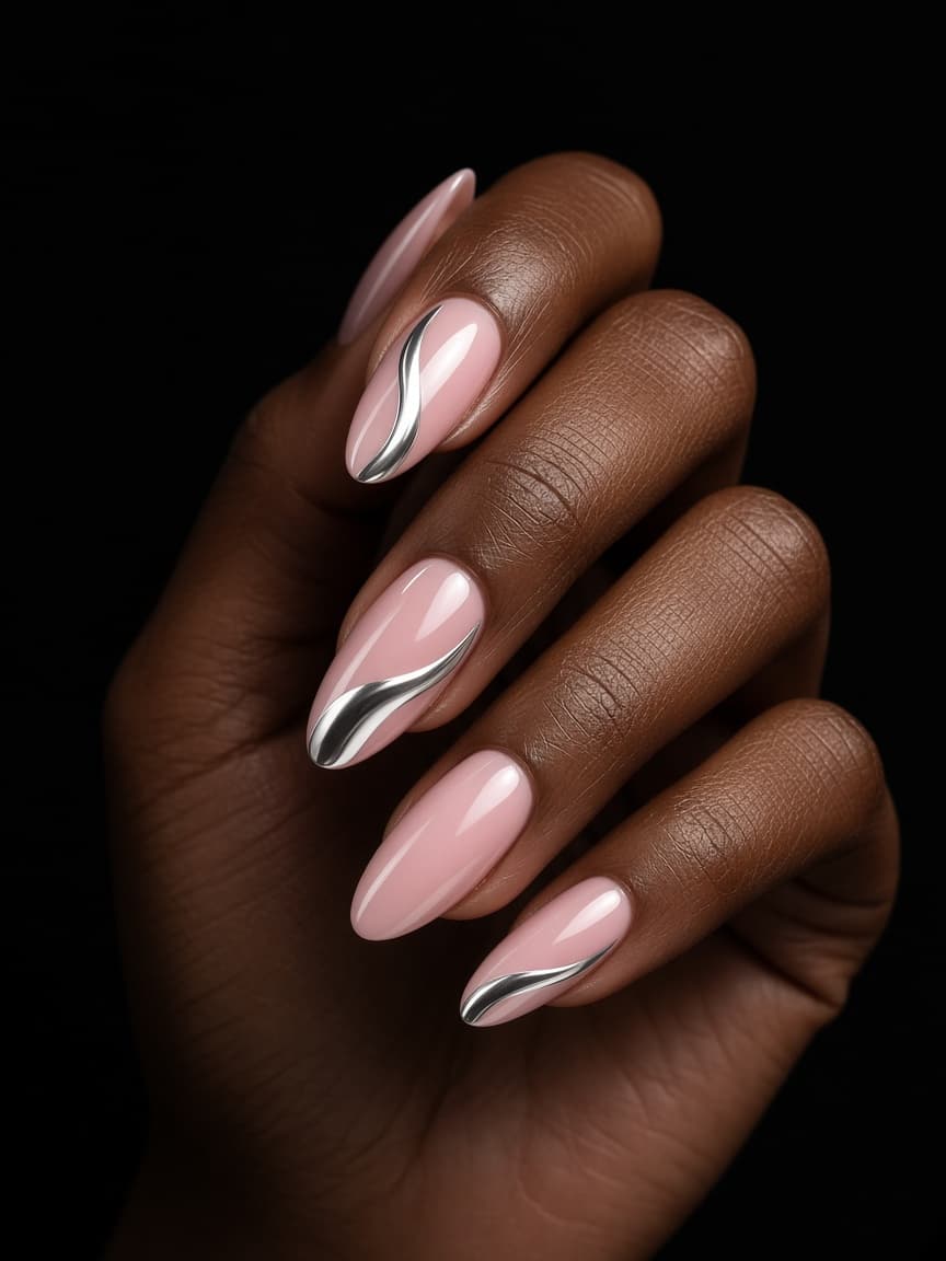 Manicured nails with pink and chrome gel art